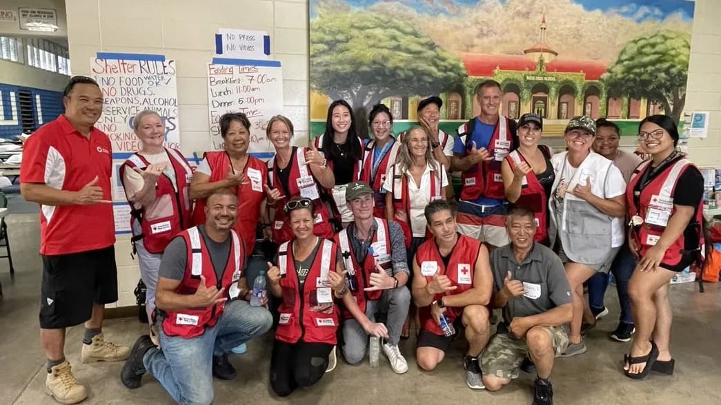 American Red Cross volunteers posing at a community relief shelter