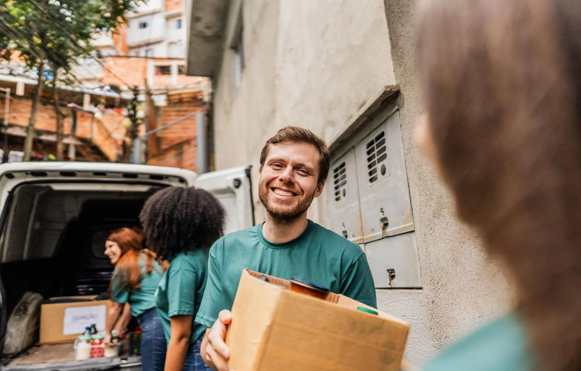 Large group of volunteers working toward a shared community goal
